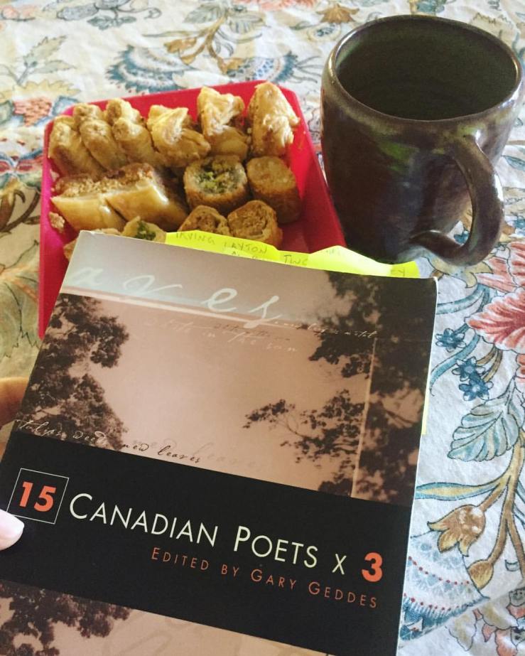 Book: 15 Canadian Poets x3 edited by Gary Geddes, with coffee cup and sweets in background